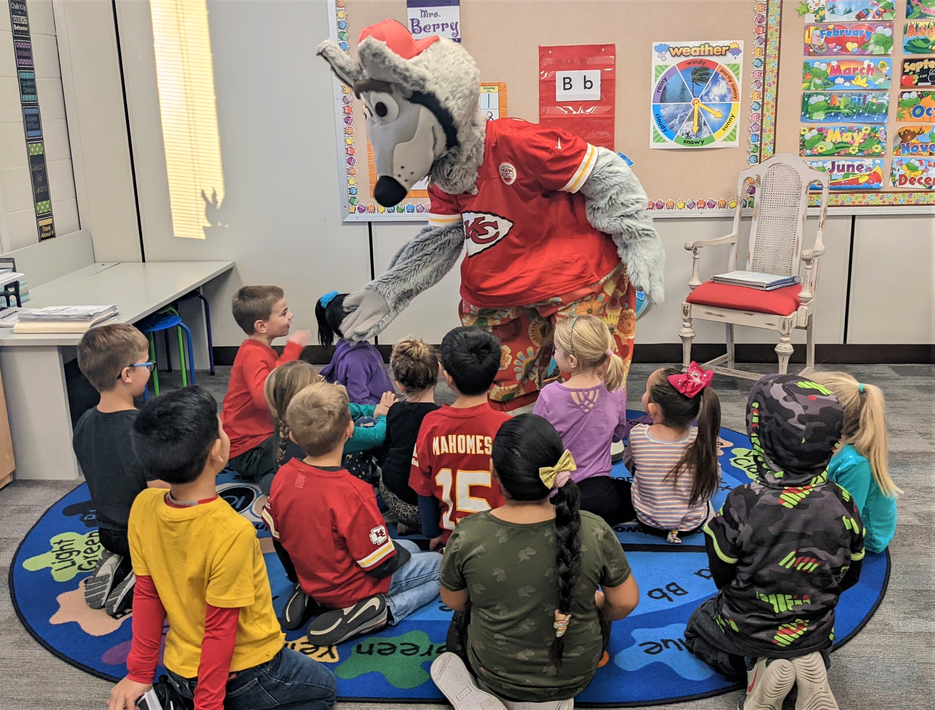 KC Wolf visits with kids at Scott City Elementary School