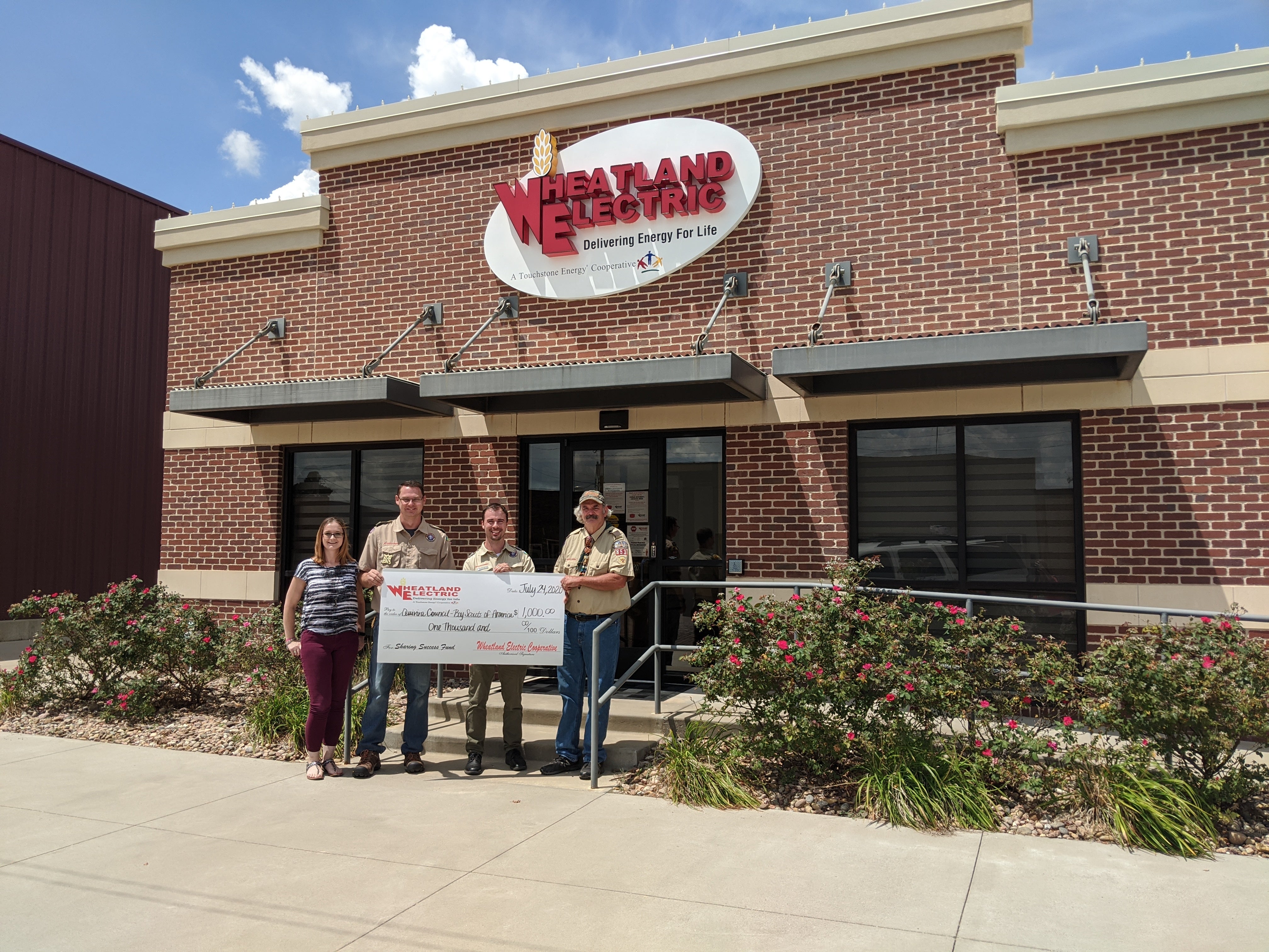 Gena Ricker (Anthony Committee Chair), Justin Ricker (Anthony Scout Master), Justin Bell (South Winds District Executive), and Mike Alldritt (Harper Scout Master) gather on July 24, 2020, to accept a $1,000 Sharing Success grant check from Wheatland Electric to the Quivira Council of Boy Scouts of America.